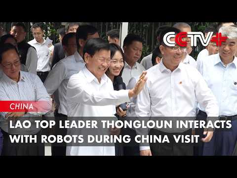 Lao Top Leader Thongloun Interacts with Robots During China Visit thumbnail