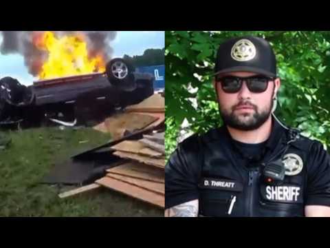Deputy Cuts Woman From Seatbelt To Free Her From Burning Car thumbnail