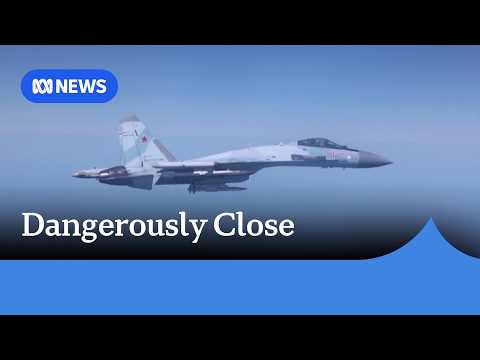 Video captures Russian fighter jets flying metres away from British spy plane | ABC NEWS thumbnail