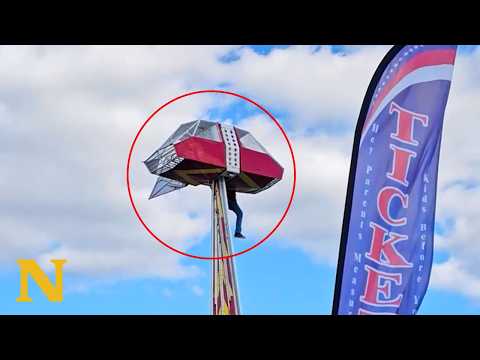 Hero Saves Child: Worker Dangles From Ride 30 Feet Up to Protect Young Girl 😱 thumbnail
