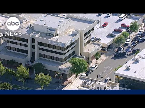 Man barricades himself inside bank with hostages after bomb threat thumbnail