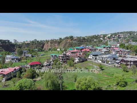 Dharamshala town spreads beneath the snowy Dhauladhar mountains in Himachal thumbnail