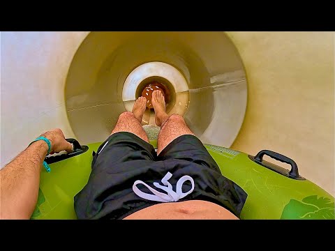 Entering the Bowl Water Slide Surrounded by Wall Art | Kalahari #poconos  thumbnail